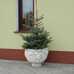 virágtartó női arccal díszítve